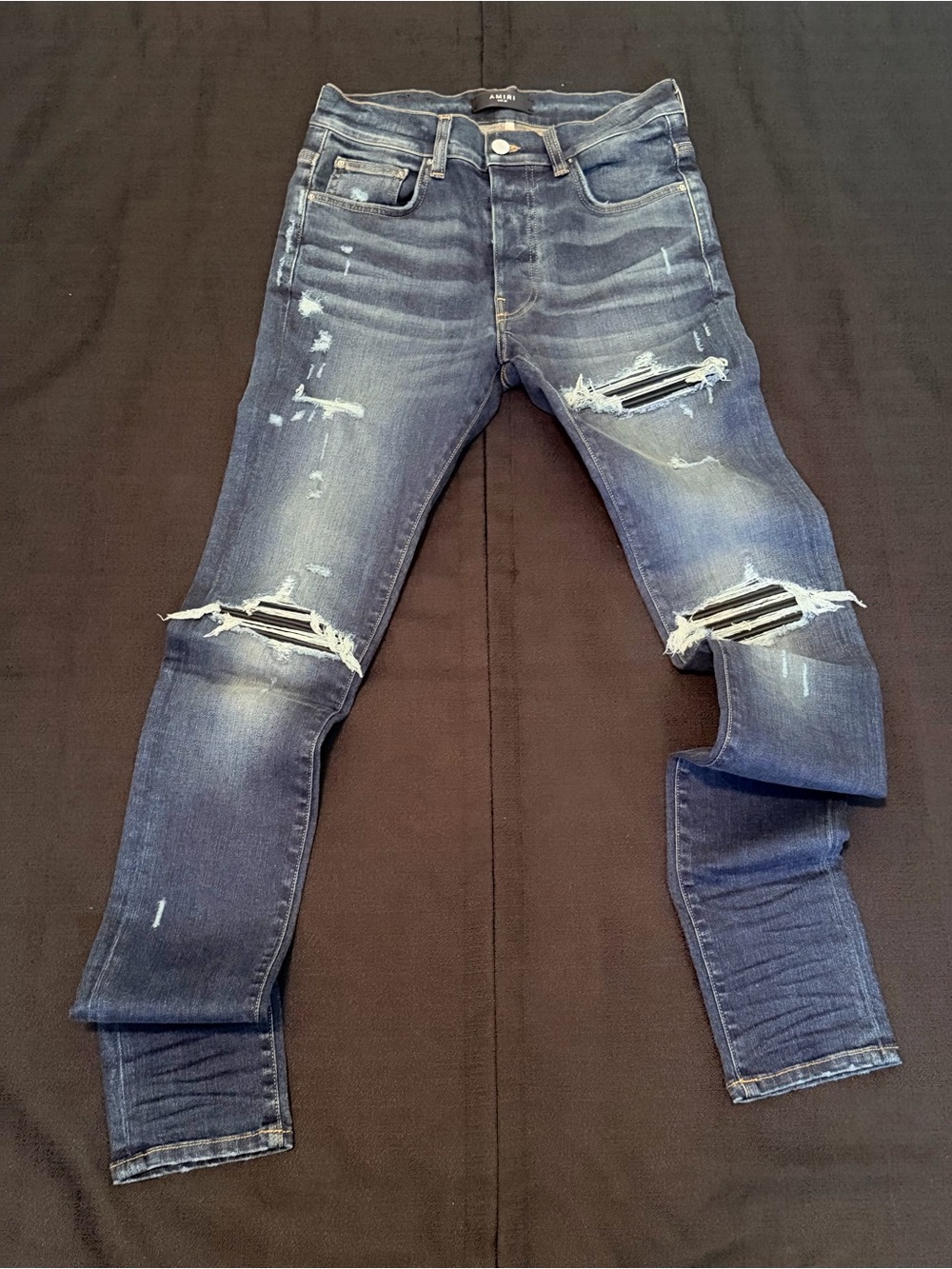 AMIRI MX1 JEAN IN ITALIAN STRETCH DENIM WITH CLASSIC FIVE-POCKET DETAILING.